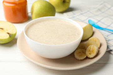 Composition with baby food on white wooden background