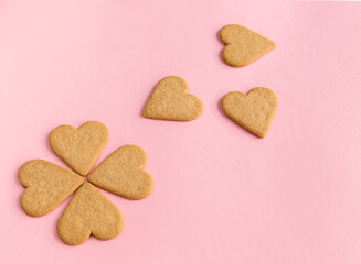 Breakfast. Heart shaped cookies. Pink background. Copy space. Top view.