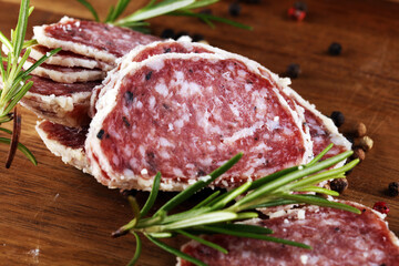 Salami truffle. The saltufo is a piece of salami mixed with summer truffle and parmesan on table