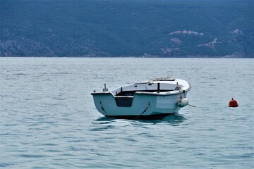Fototapeta na wymiar Little white boat on the sea