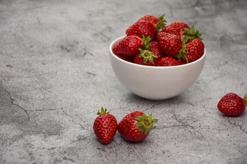 White bowl of strawberries