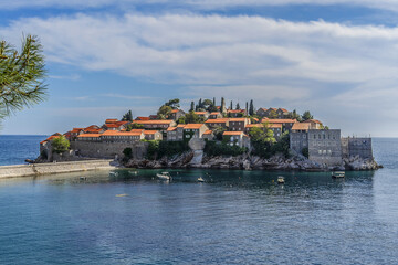 Obraz premium Famous Sveti Stefan (now Aman Sveti Stefan) - small islet and Luxury hotel resort in Montenegro, approximately 6 kilometers southeast of Budva. Montenegro, Europe.