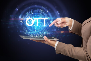 Close-up of a touchscreen with OTT abbreviation, modern technology concept