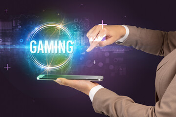 Close-up of a touchscreen with GAMING inscription, new technology concept