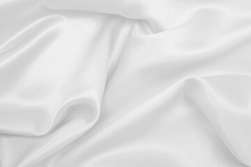 Smooth elegant white silk or satin luxury cloth texture as wedding background. Luxurious background design