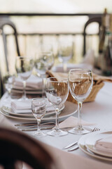 wine glasses on the festive table with white tablecloth
