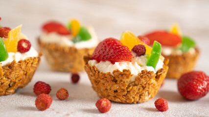 Healthy food and diet concept. Oatmeal backed cups with yogurt and berries. Weekend breakfast. Delicious food at home