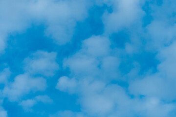 Fototapeta na wymiar fluffy clouds on a blue background