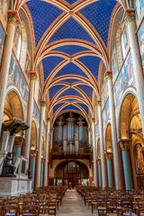 Fototapeta na wymiar Paris, France - June 9, 2020: View the organ of the Abbaye Saint-Germain-des-Pres abbey, a Romanesque medieval Benedictine church located on the Left Bank in Paris.
