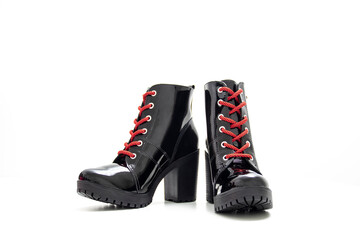 Women's winter boots. Black confortable boots in background white