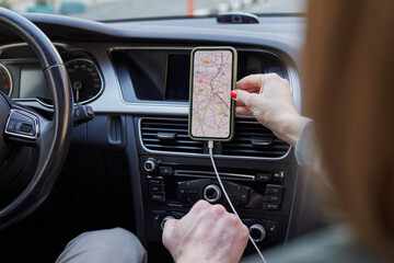 Couple of tourists deciding road direction using GPS navigation