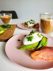 Avocado toast with poached egg and smoked salmon.