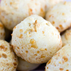 Brazilian cheese bread (pao de queijo), a typical specialty made of cheese, cassava starch, milk, eggs and oil, mixed all together and baked forms a delicious crusty shell with soft springy center