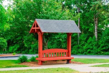 Red chair with roof on street