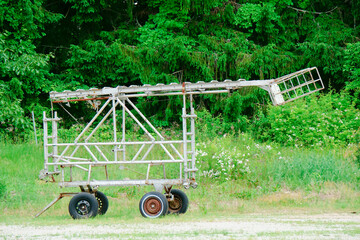 Sky lift trailer in field