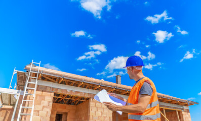 inspection of the construction project, manager on the construction of a family house. copy space