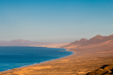 Landscape of Panoramic vulcanic mountains and Atlantic Ocean ,  dunes of coralejo and Gran Tarajal Port in Fuerteventura, Lanzarote 