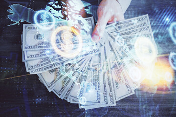 Multi exposure of financial graph drawing hologram and USA dollars bills and man hands. Analysis concept.