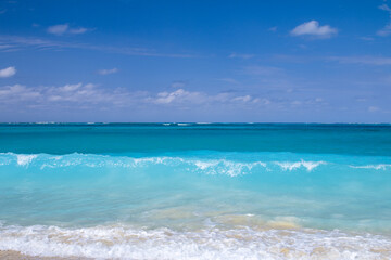 Beautiful turquoise blue waves on Caribbean beach
