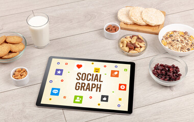 Fototapeta na wymiar Healthy Tablet Pc compostion with SOCIAL GRAPH inscription, Social networking concept