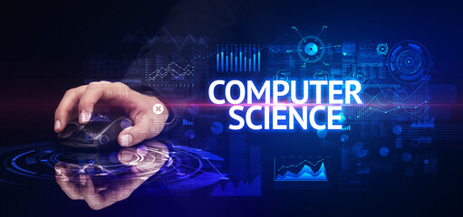 hand holding wireless peripheral with COMPUTER SCIENCE inscription, modern technology concept