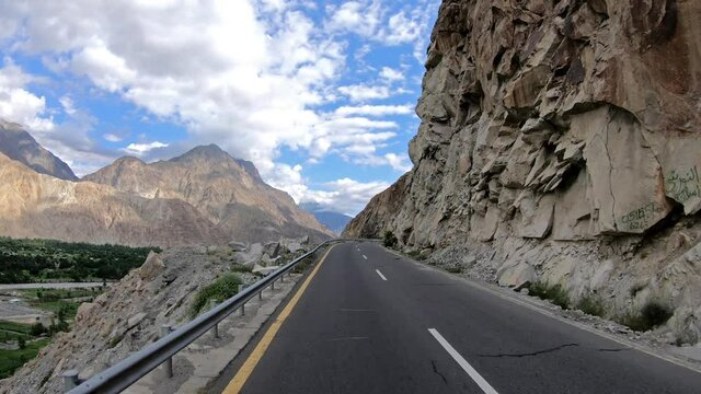 Travelling on the beautiful Karakoram Highway In A Beautiful Sunny day In Gilgit Baltistan, Pakistan