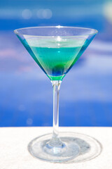 blue drink with a pool in the background