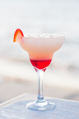 red strawberry cocktail on a white background