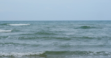 Ocean waves crashing on beach