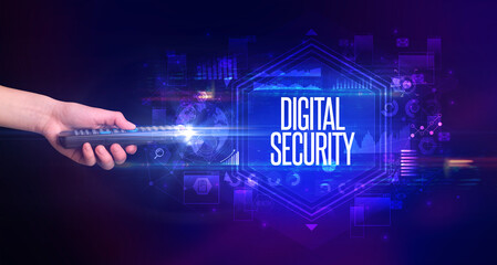hand holding wireless peripheral with DIGITAL SECURITY inscription, cyber security concept