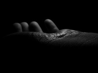 hand on black background