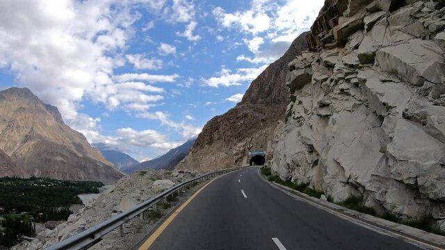 Travelling on the beautiful Karakoram Highway In A Beautiful Sunny day In Gilgit Baltistan, Pakistan