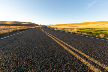 Fototapeta na wymiar Morning Highway Drive through Eastern Washington State Wheat Fields