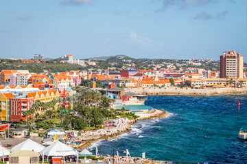 Fototapeta na wymiar The Colorful Buildings Along The Shoreline of Otrabanda and Punda in Willemstad, Curaçao