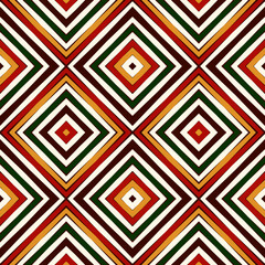 Seamless pattern in Christmas traditional colors. Repeated squares and rhombuses bright ornamental abstract background.