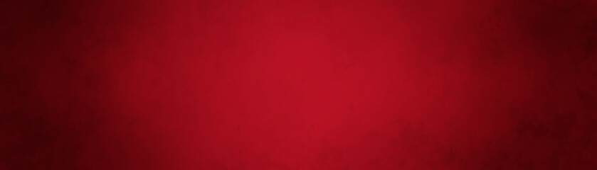 Red Christmas background texture design in panoramic banner or old vintage background template with shiny center and black vignette