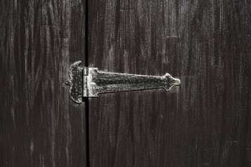 Loop of wrought iron wooden door, sash.