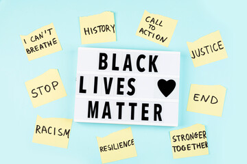 Lightbox with inscription Black lives matter on blue background. Flay lay, top view, overhead. High quality photo