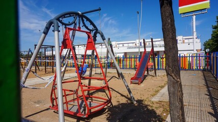 Colorful kids playground with slider and swing