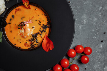 Tasty Tom Yum soup with shrimps and coconut milk