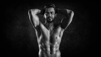 Fototapeta premium athletics strong bodybuilder man posing show his muscle in gym