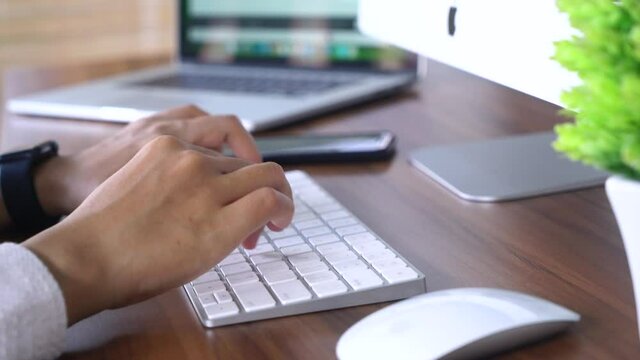 Bali Indonesia June 18, 2020 : female hands typing on keyboard, work from home.