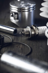 Spark plug. Chainsaw engine parts. Cylinder, piston, rings. Garden equipment service and repair