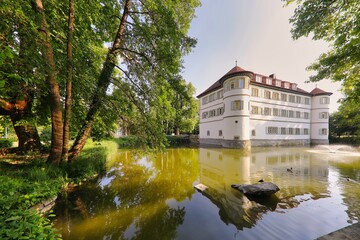 View of the Moated Castle surrounded with trees in Bad Rappenau, Germany