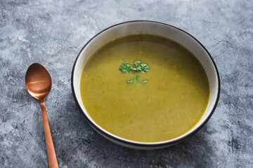 plant-based food, vegan green soup with potato onions and leek