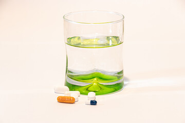 Pills in front of a glass, Medicine