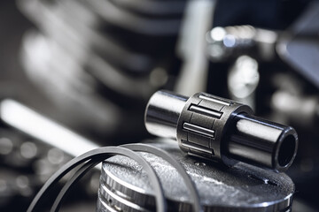 Chainsaw engine parts. Cylinder, piston, rings, pin, spark plug. Garden equipment service and repair