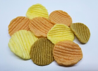 Variety colors of vegetable chips on a white isolated background