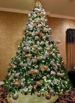 Gold And Silver Ornaments On A Christmas Tree