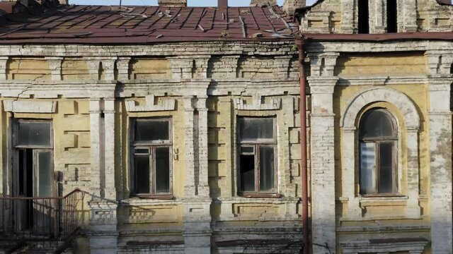 Abandoned old manor (mansion) house with broken windows. Deserted 19th century building. Aerial side view